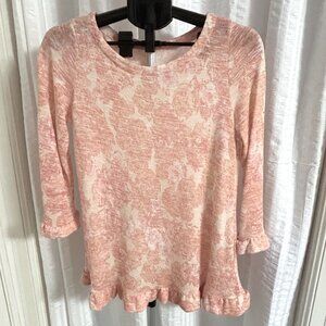 Muted peachy-pink knit floral top w/ ruffled bottom